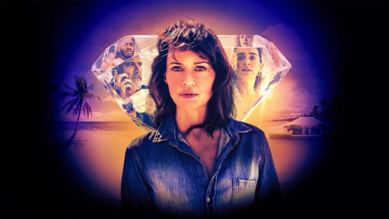Carla Gugino in a denim shirt in front of a diamond with other cast members reflected in it, in Leopard Skin tv series on Showmax