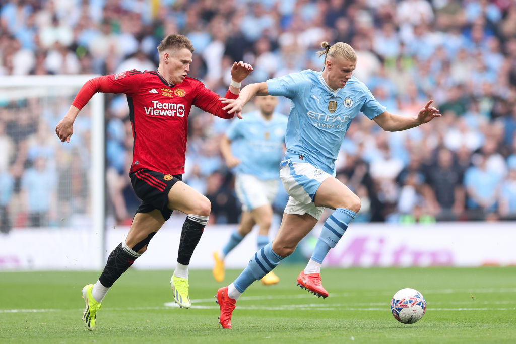 Scott McTominay of Manchester United battles for possession with Erling Haaland of Manchester Ciity during the Emirates FA Cup Final live on Showmax Premier League